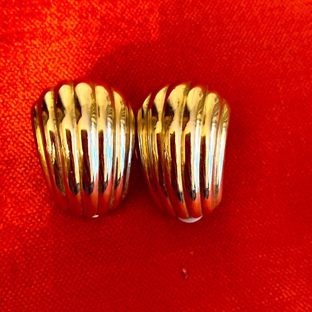 Gold tone clip earrings.